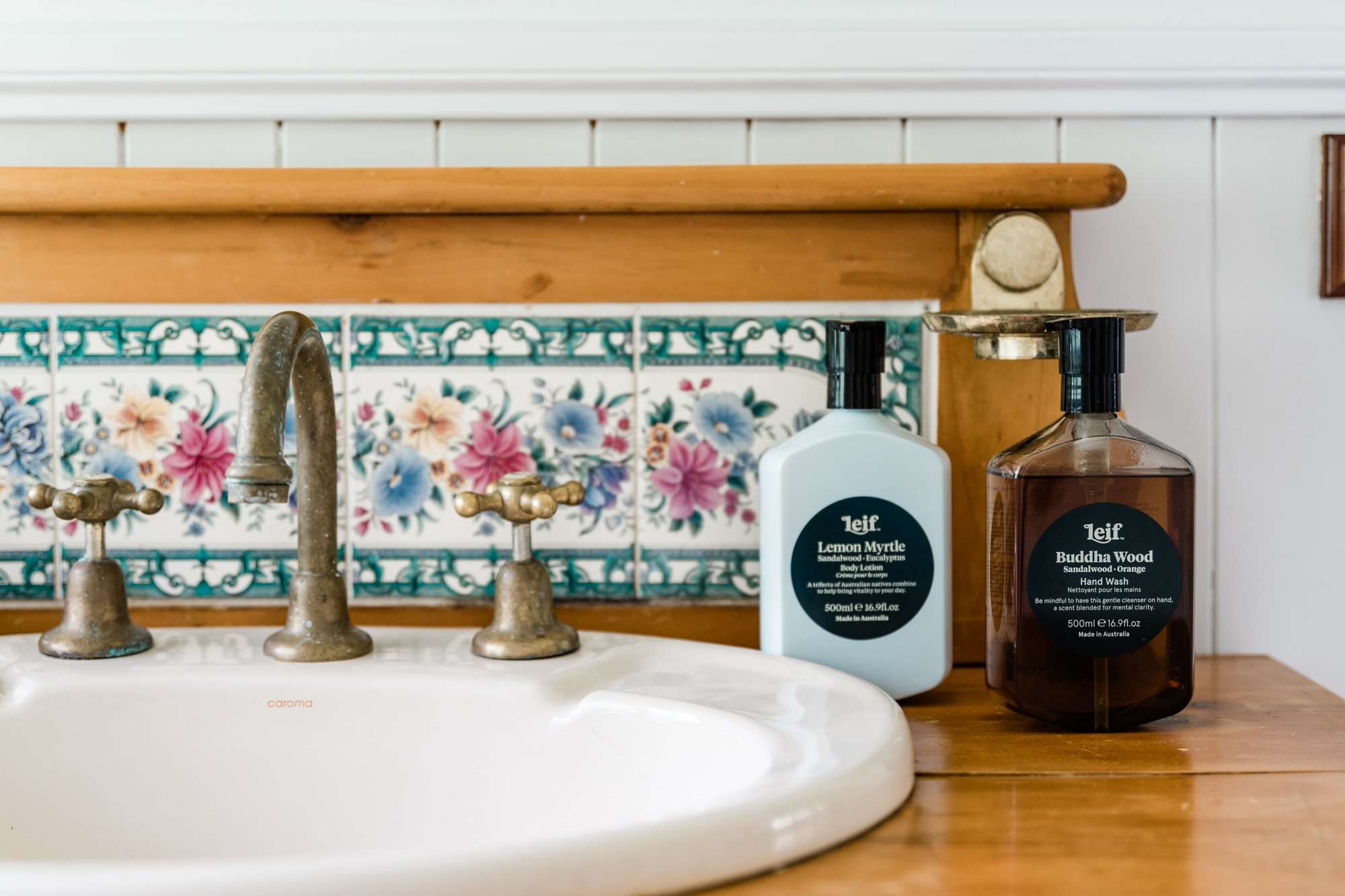 Complimentary Leif toiletries next to an antique basin and printed tiles in the bathroom at Maiala Park Lodge - D'Aguilar Range Queensland