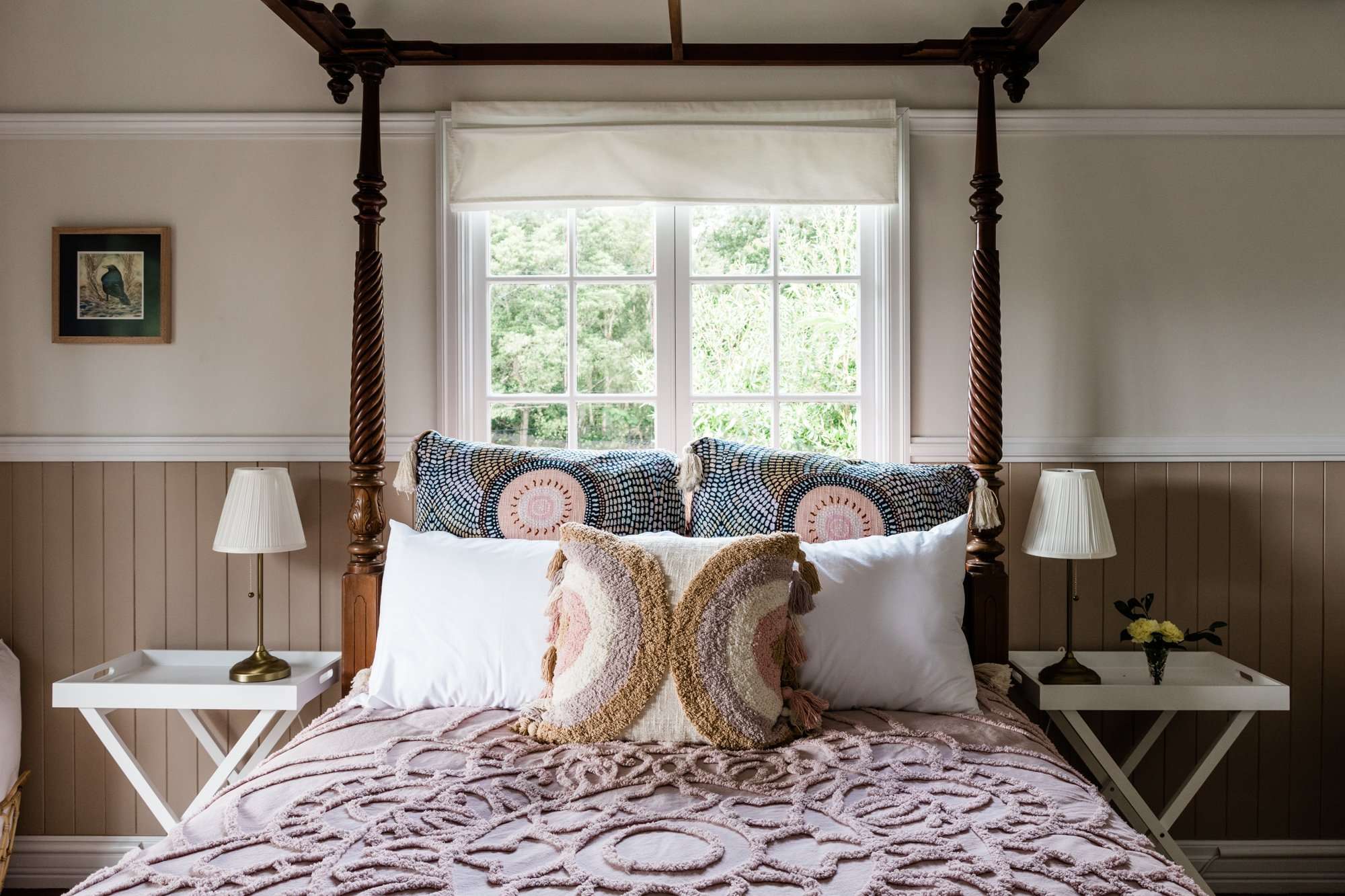 Bowerbird cottage four-poster bed, side tables, lamps and wall art for a memorable getaway in Mount Glorious QLD